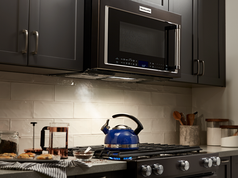 A KitchenAid® over-the-range microwave and oven in a modern kitchen.