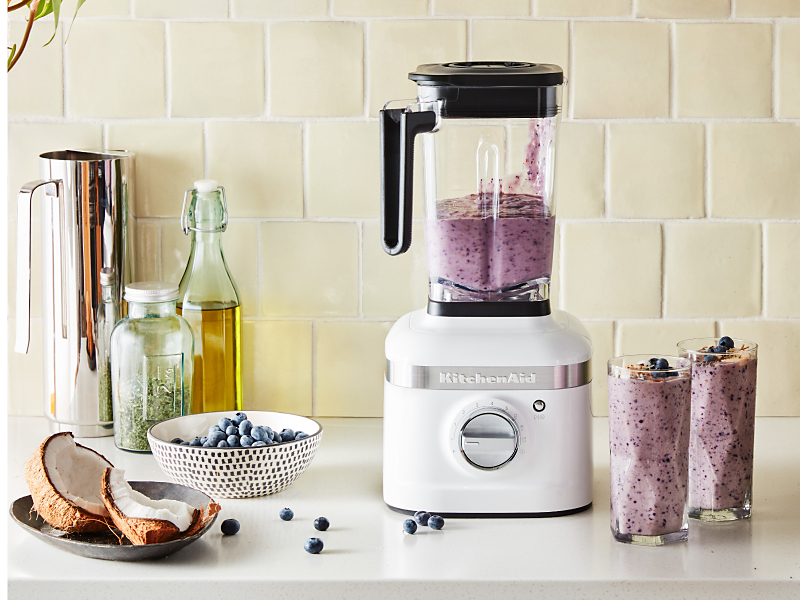KitchenAid® blender on countertop with blueberries and bananas