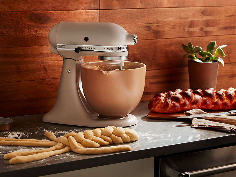 KitchenAid® stand mixer with freshly baked bread on the counter.
