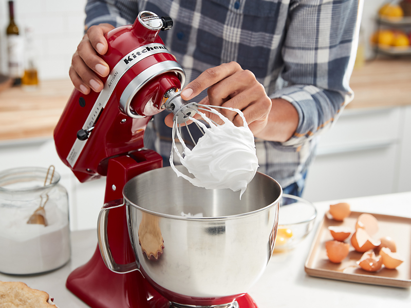 Red KitchenAid® stand mixer making homemade meringue