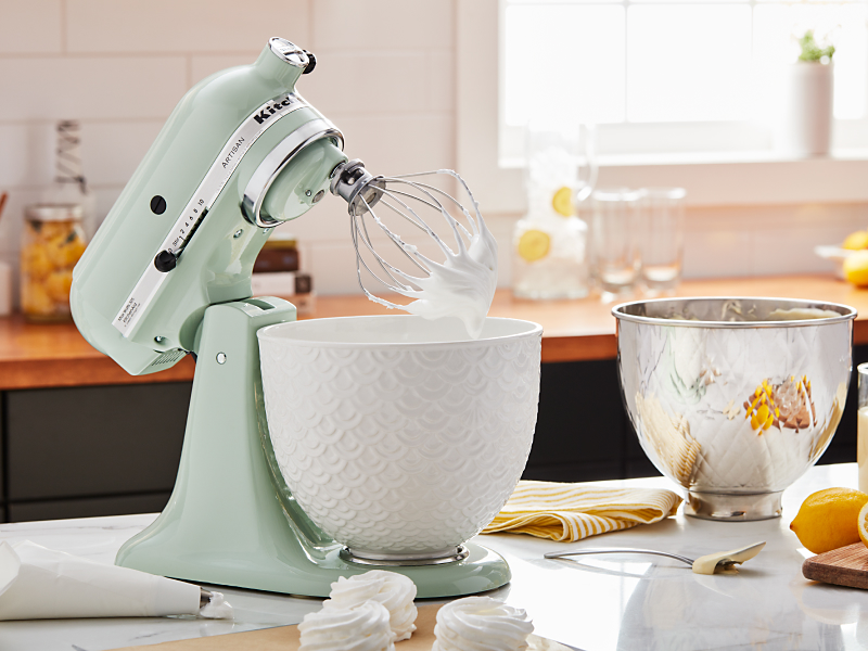 Mint green KitchenAid® stand mixer with ceramic bowl and whisk attachment