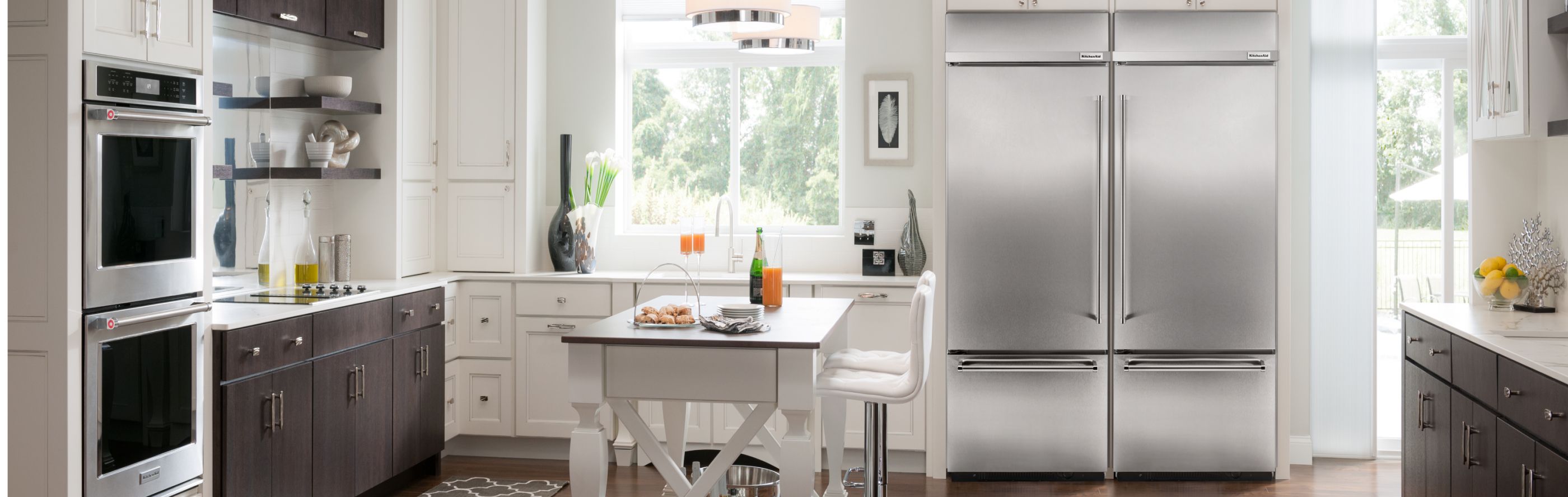 Stainless steel KitchenAid® french door refrigerator built into a modern kitchen