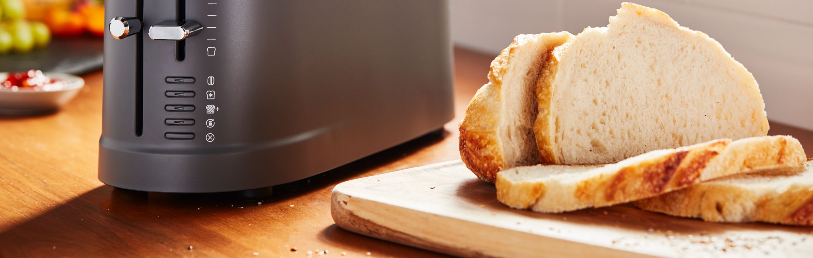 Sliced bread next to a black countertop appliance