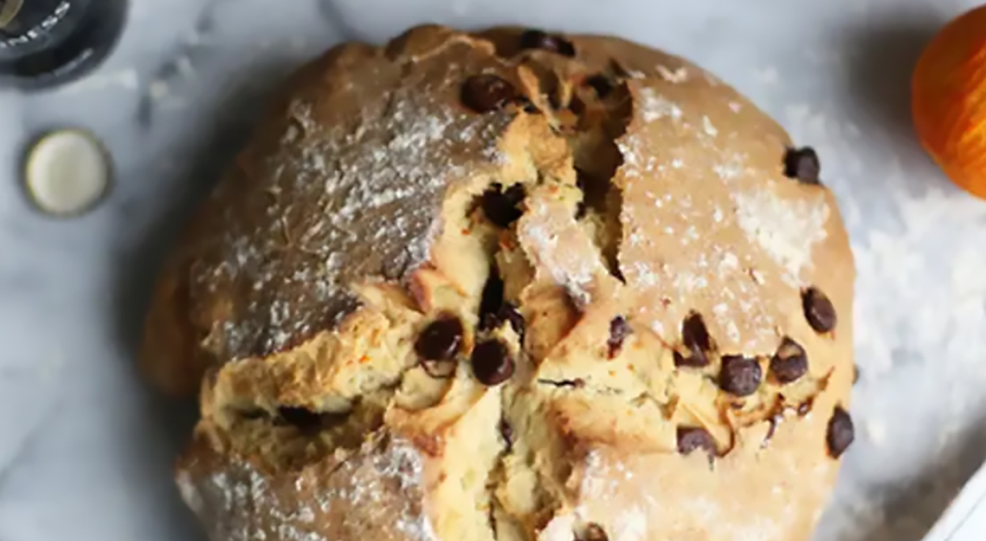 A loaf of bread with chocolate chips baked inside