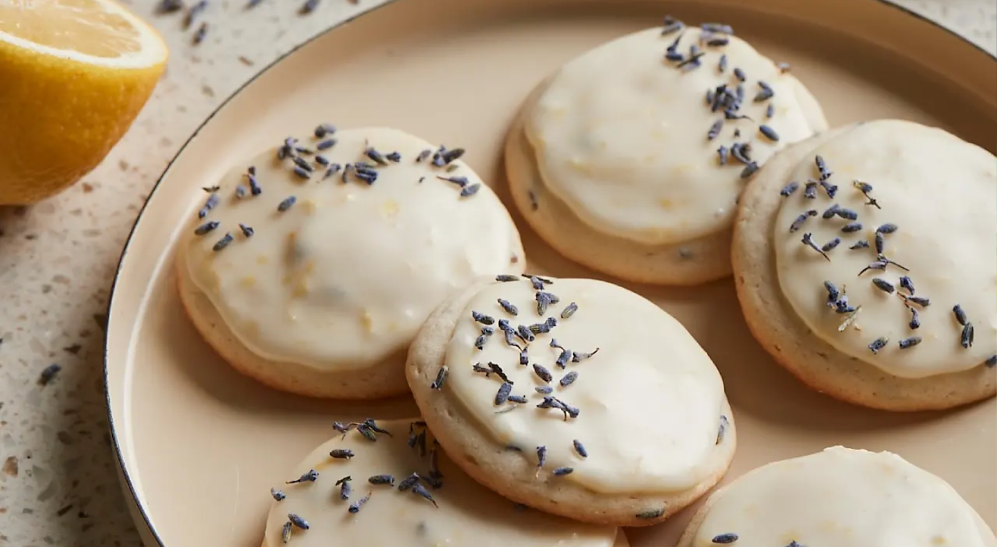 Frosted cookies topped with herbs