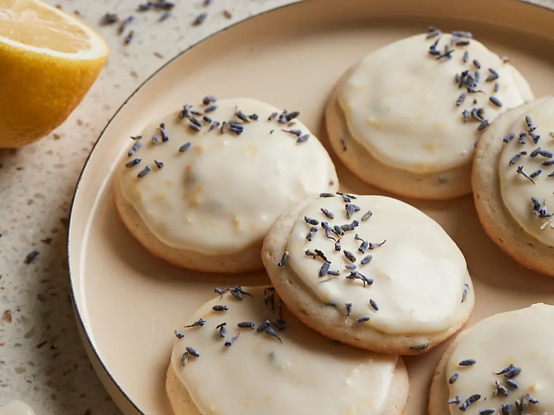 Frosted cookies topped with herbs
