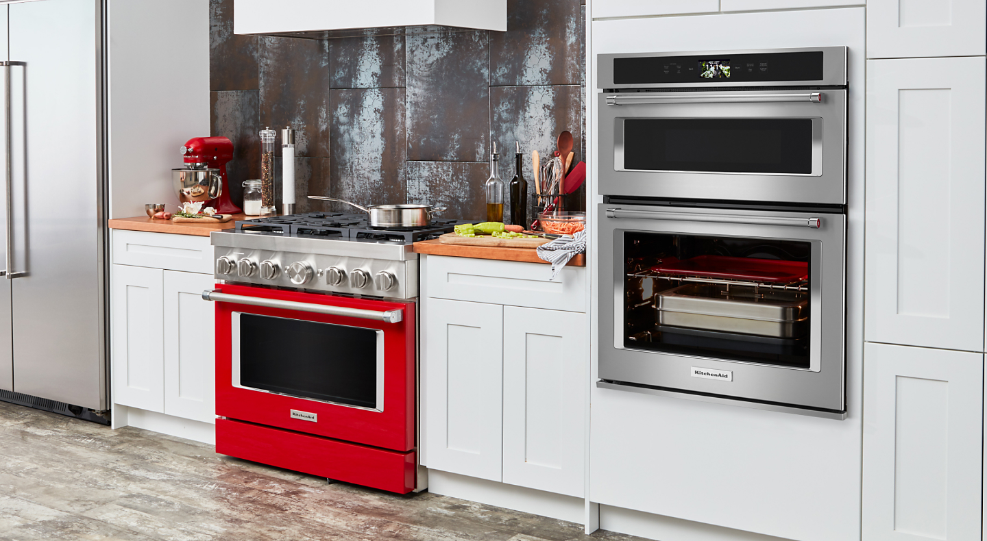 KitchenAid® stainless steel combination wall oven in white cabinetry