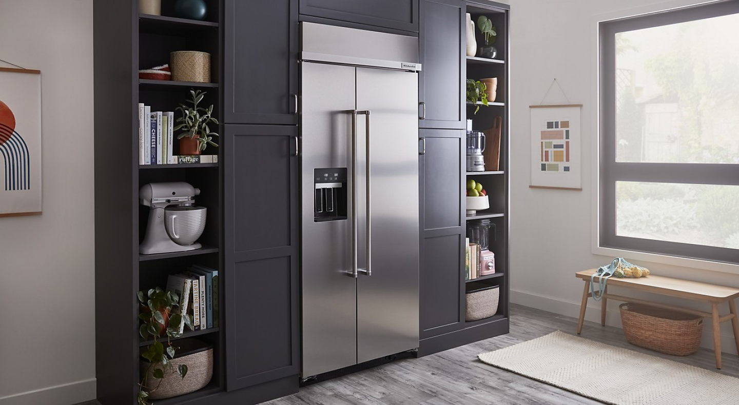 Built-in stainless steel KitchenAid® side-by-side refrigerator in gray-blue cabinetry