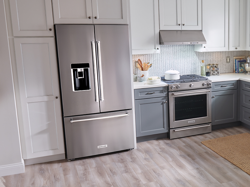 Stainless steel, KitchenAid® French-door refrigerator in white cabinetry