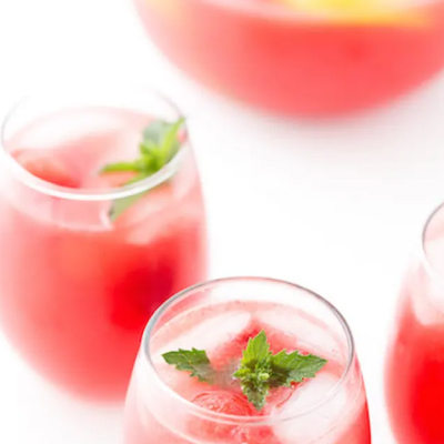 A glass of non-alcoholic watermelon sangria.