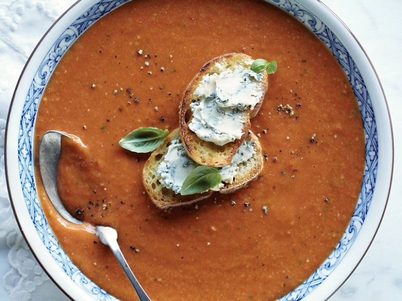 Bowl of tomato soup with grilled cheese toast