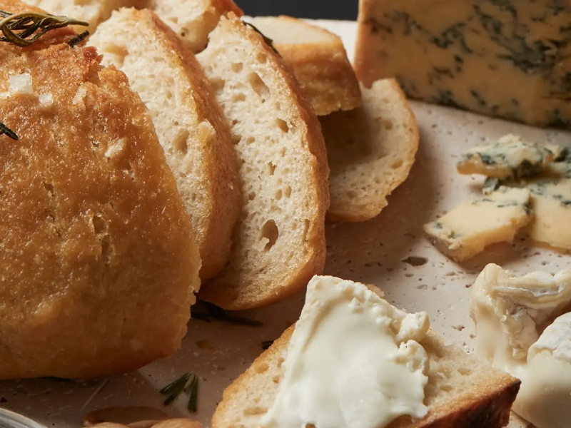 Sliced Italian bread with blue cheese