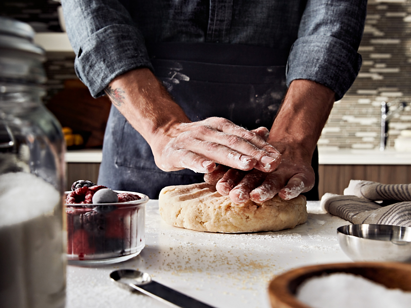 Person making pie dough