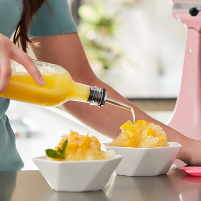 Mango Hawaiian shave ice next to a pink KitchenAid® stand mixer