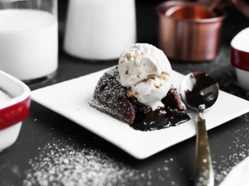 Chocolate molten cake with ice cream on white plate