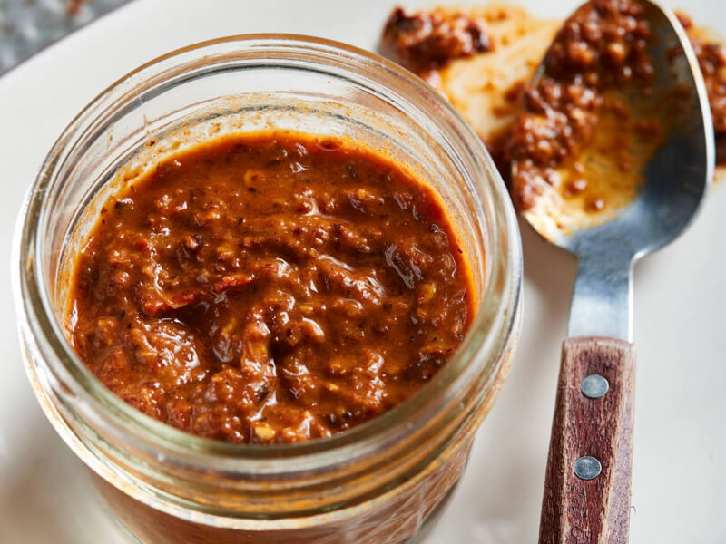 Chili paste in clear glass jar