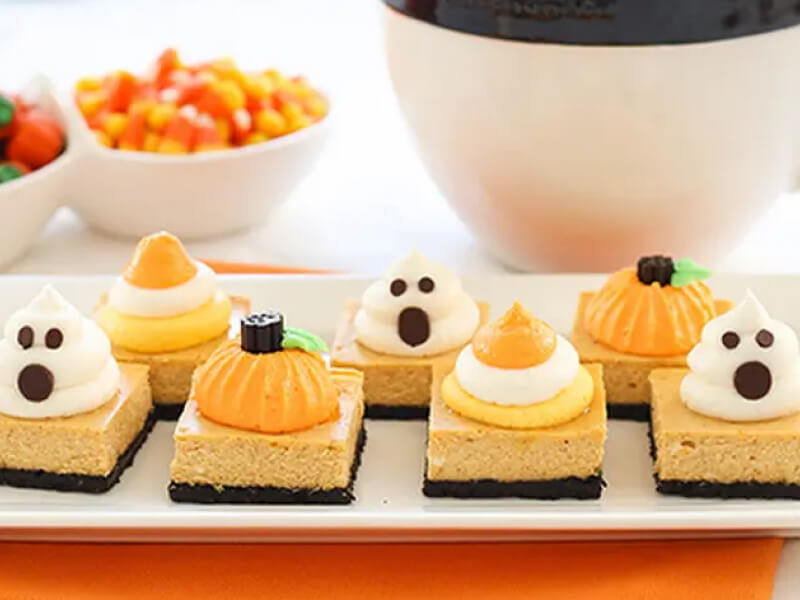 Pumpkin cheesecake squares decorated for Halloween