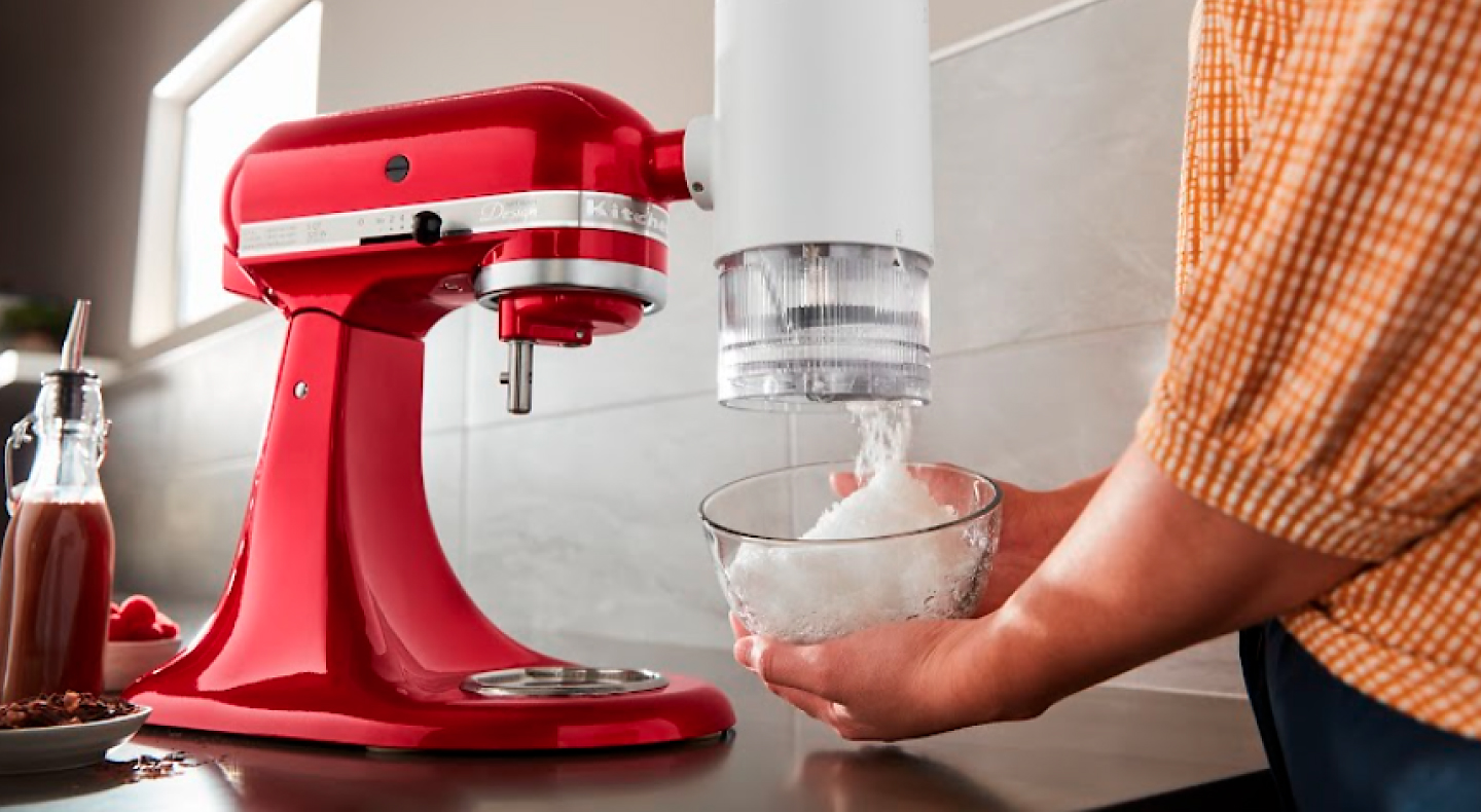 Red KitchenAid® stand mixer with the Shave Ice Attachment.