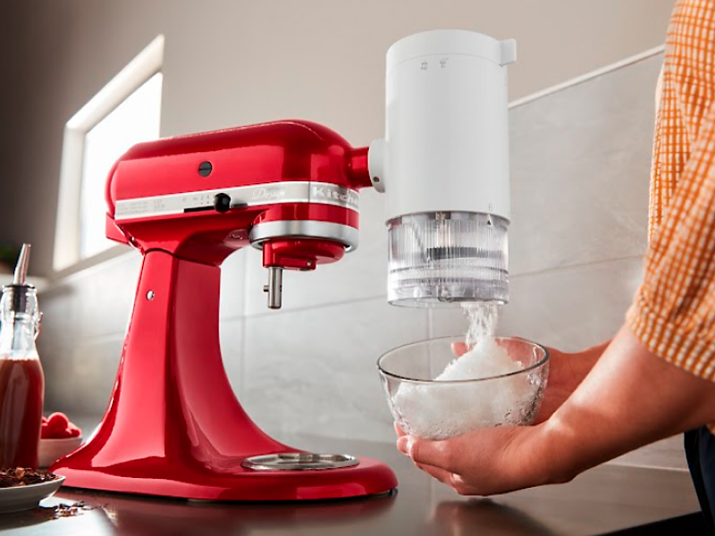 Red KitchenAid® stand mixer with the Shave Ice Attachment.