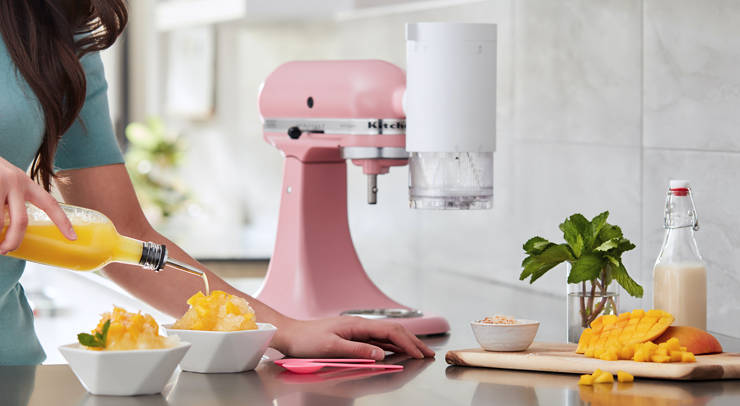 Person making mango flavored shaved ice with their KitchenAid® stand mixer.