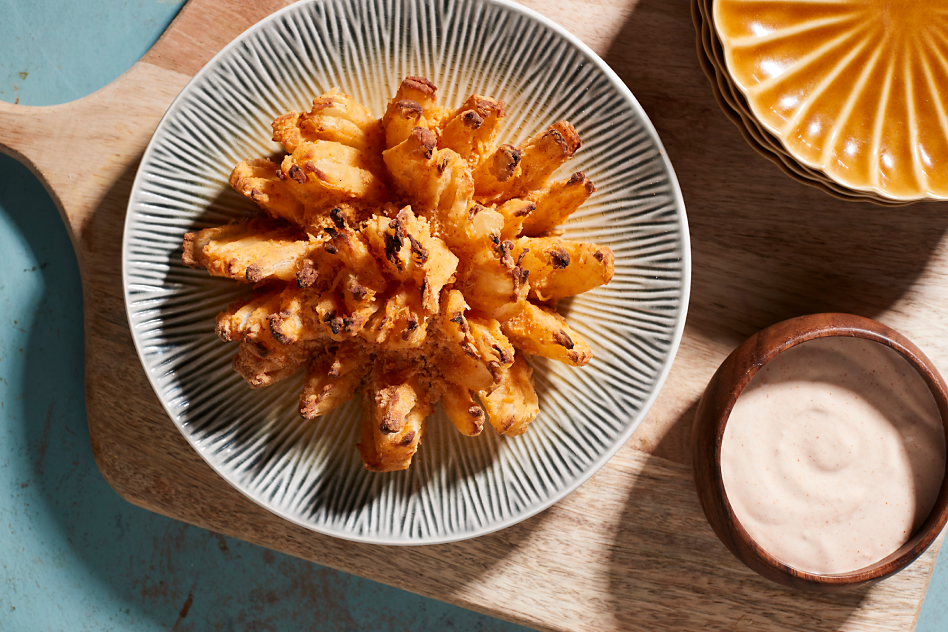Fried blooming onion with dipping sauce