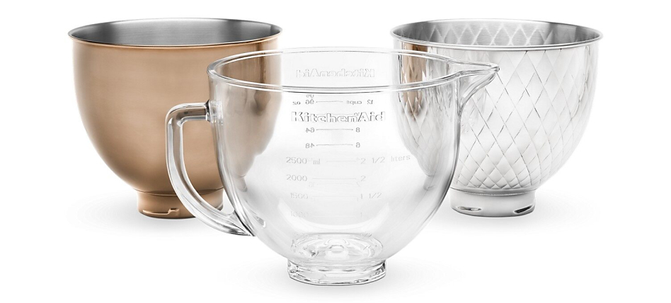 Three interchangeable stand mixer bowls in glass, quilted stainless steel and radiant copper