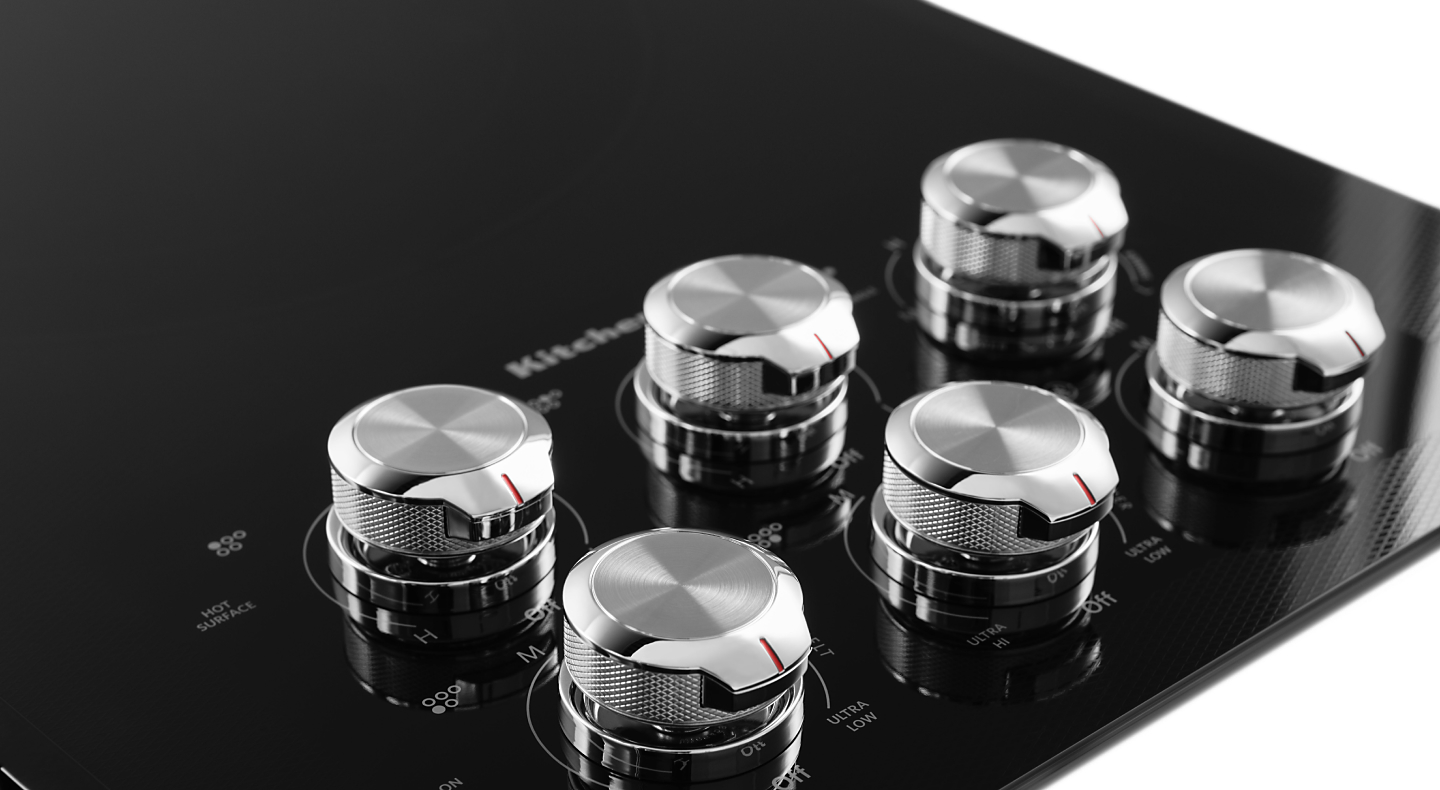 Knobs on a KitchenAid® cooktop