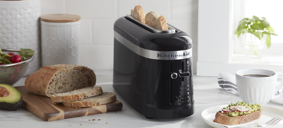 Black one-slot toaster with slices of bread
