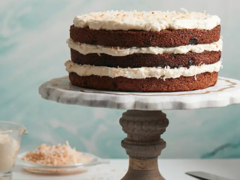 A three-layer carrot cake with cream cheese frosting.