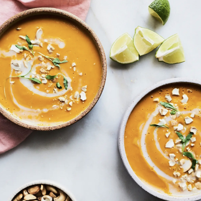 Carrot and sweet potato soup in earthenware bowls