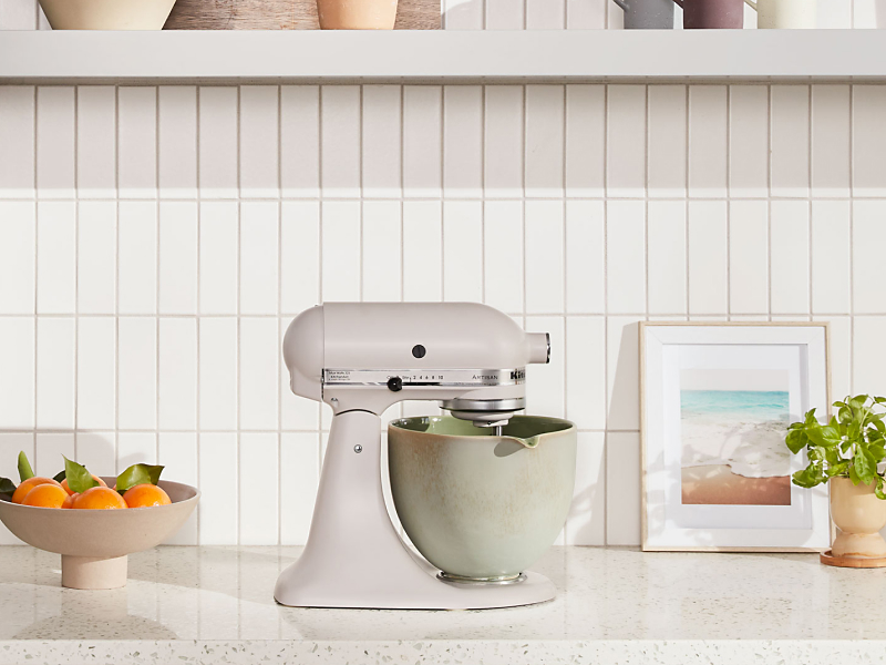 KitchenAid® stand mixer with green ceramic bowl on countertop