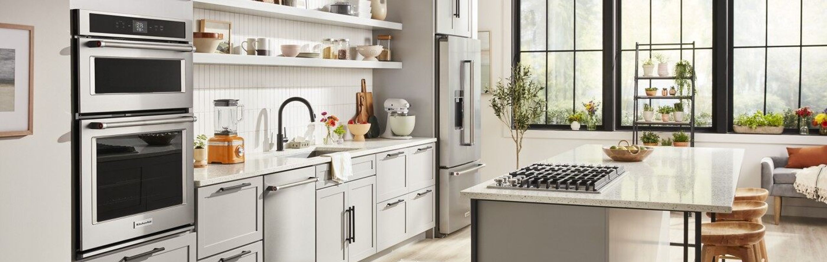 KitchenAid® appliances in a black and white themed kitchen.
