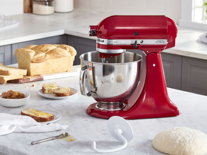 KitchenAid® stand mixer with dough hook and homemade bread on counter