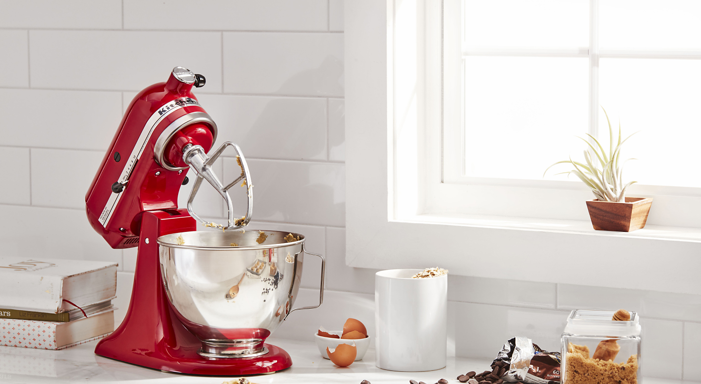 KitchenAid® stand mixer with flat beater next to cookie dough ingredients