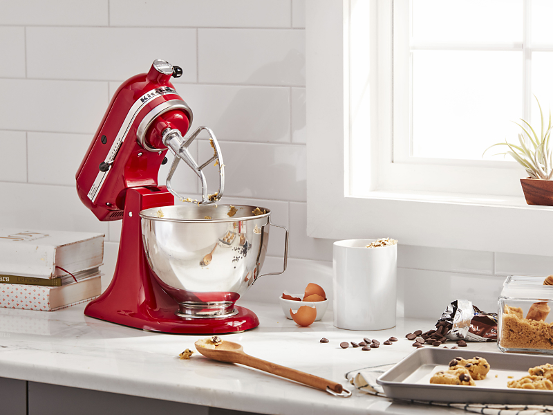 KitchenAid® stand mixer with flat beater next to cookie dough ingredients
