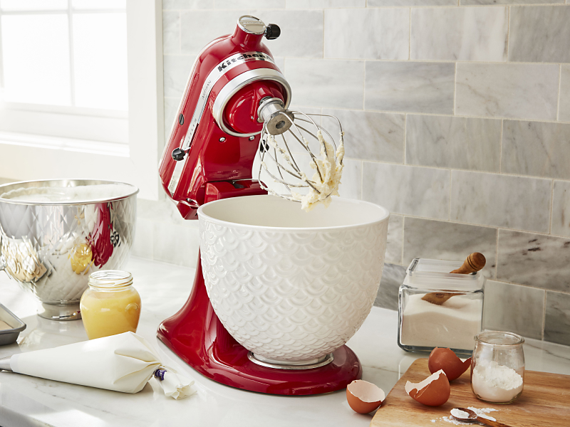 KitchenAid® stand mixer with wire whip next to homemade meringues