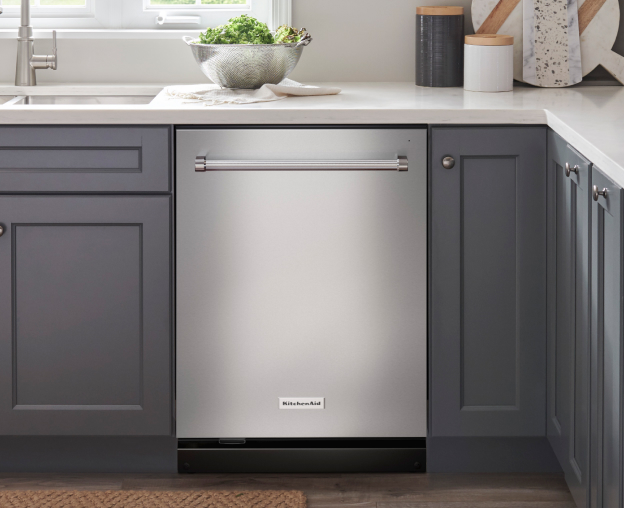 Stainless steel KitchenAid® dishwasher in blue kitchen