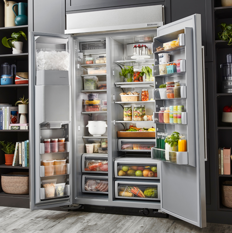 Open, stocked side-by-side refrigerator