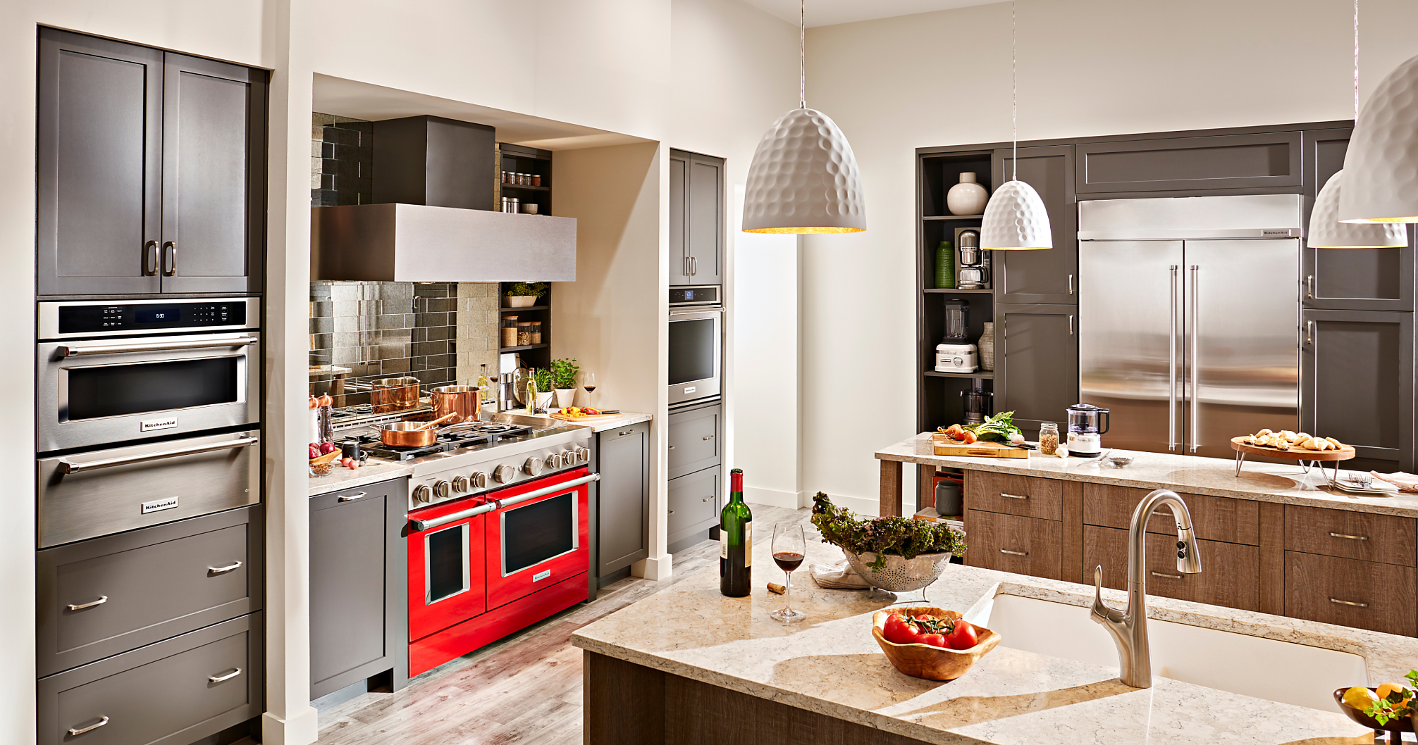 Red commercial style range in gray kitchen