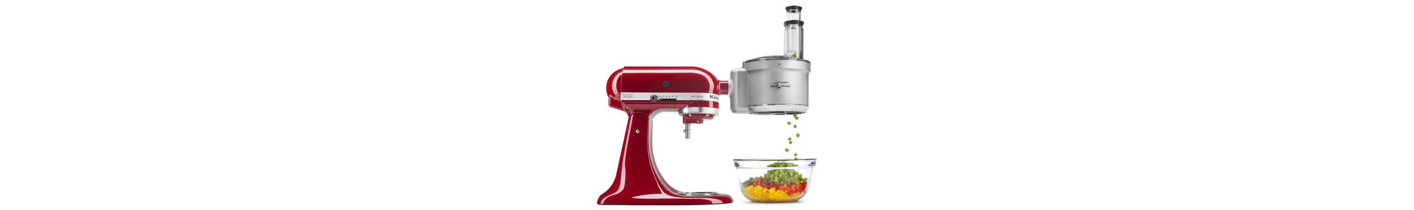 Red stand mixer with food processor attachment dicing peppers in to a bowl