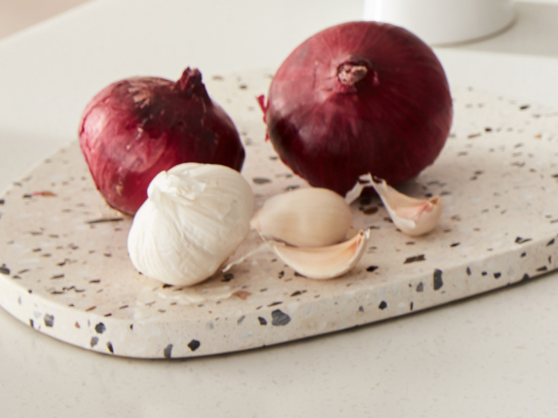 Garlic and onion on a cutting board
