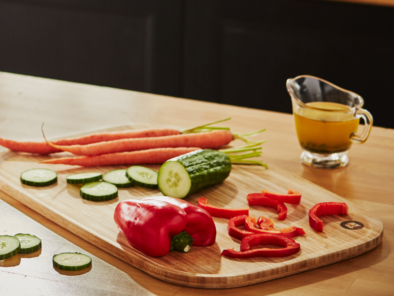Bell pepper, cucumber and carrot on a cutting board