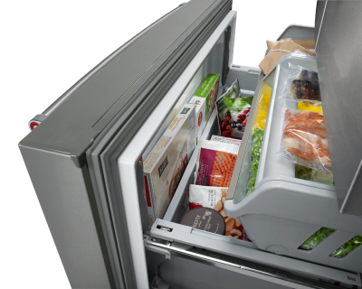 Open bottom freezer door stocked with food