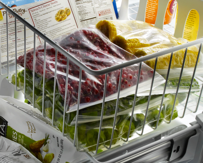 Leftovers in freezer bags inside a freezer bin