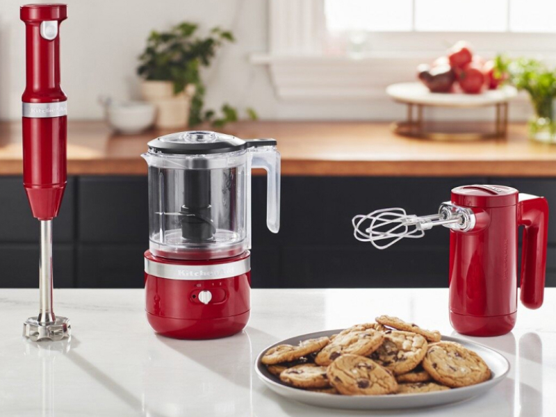 Red cordless KitchenAid® hand blender, food chopper and hand mixer on counter