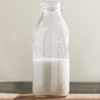 A half-full bottle of milk