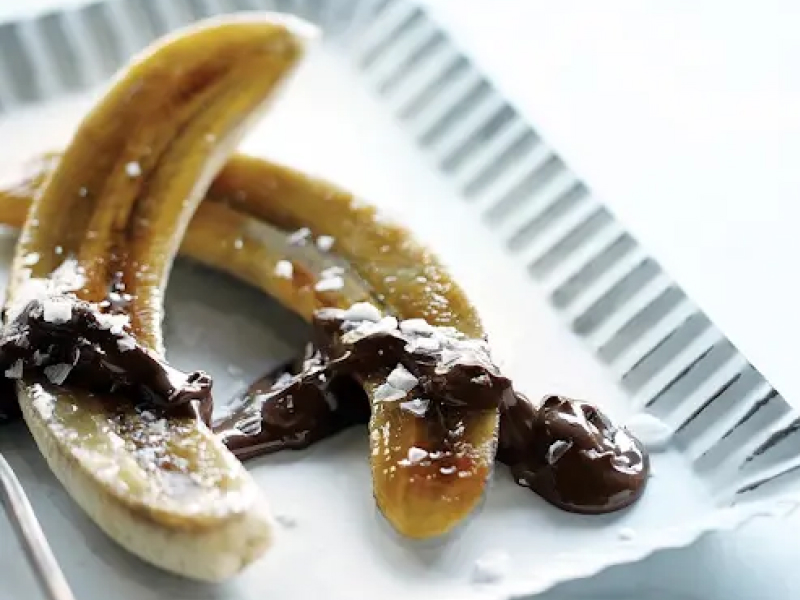 Caramelized bananas on white serving tray