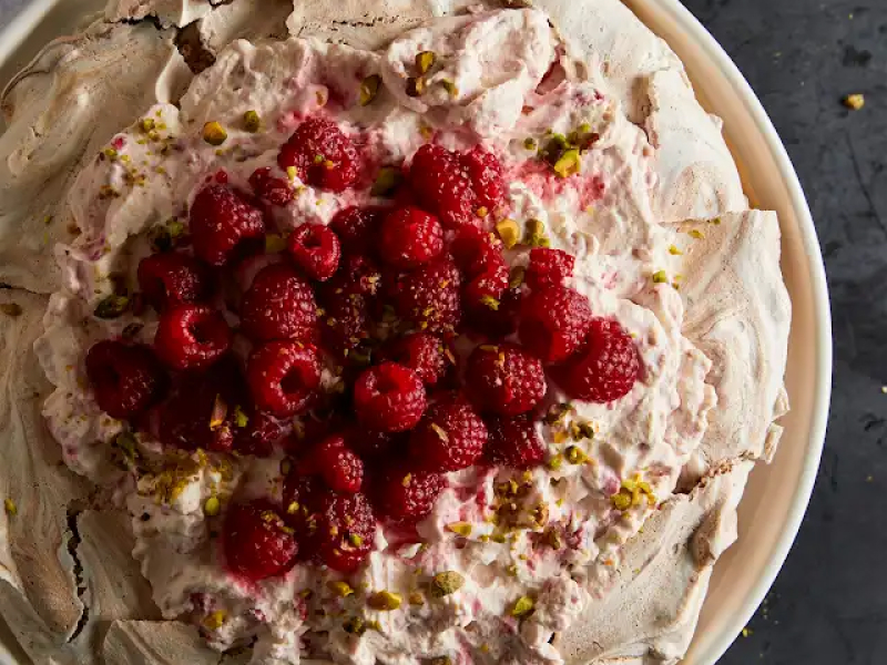 Pavlova with raspberries and raspberry whipped cream