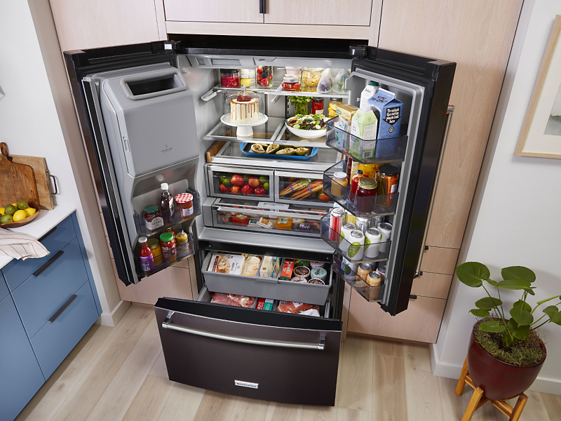 Birds-eye view of full, black stainless KitchenAid® French door refrigerator