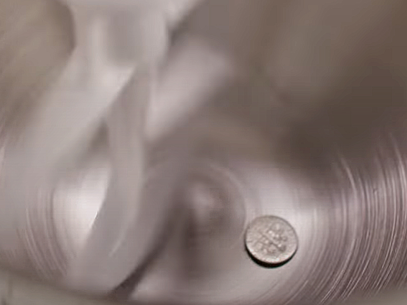 A dime in a stand mixer bowl